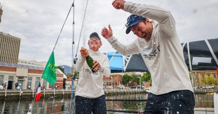 Two French sailors in a 35-foot boat are set to win handicap honors in the Sydney to Hobart race