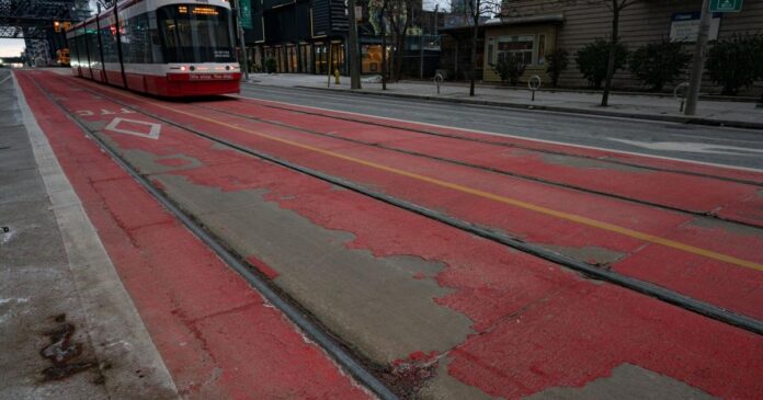 Paint on newly installed priority streetcar lanes peeling weeks after being painted
