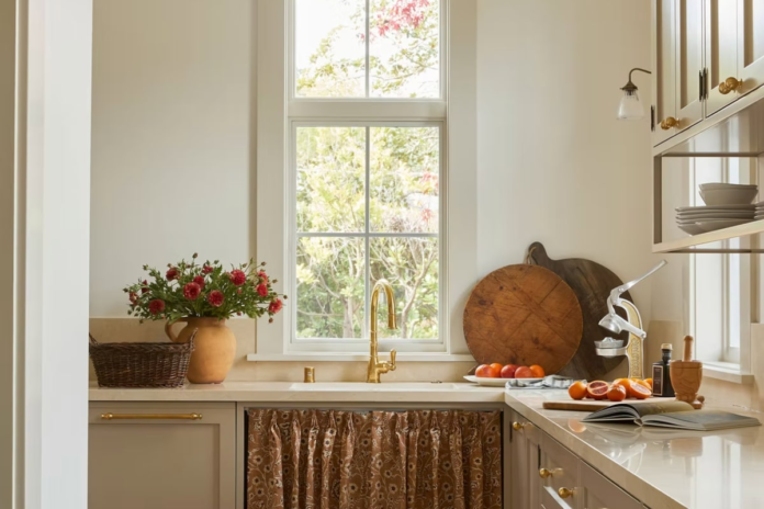 The nostalgic, farmhouse-inspired sink skirt is having a moment