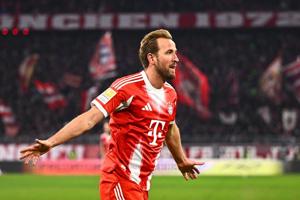 Michael Olise celebrating after scoring a goal for Bayern Munich